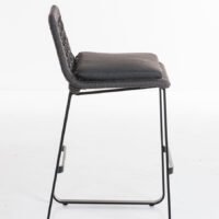 Side view of a modern bar stool featuring a woven backrest, grey padded seat, and black aluminium frame, suitable for kitchen islands or outdoor patios.