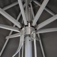 Close-up view of market umbrella mechanical structure, highlighting aluminium joints, thickened reinforced connections, and precise craftsmanship for durability
