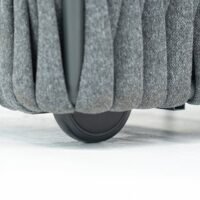 close-up of the wheels on outdoor rope sun lounger, showing its lightweight and highly portable