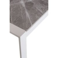 Outdoor Ethan marble dining table detail, showing marble texture and precise top-to-frame connection.